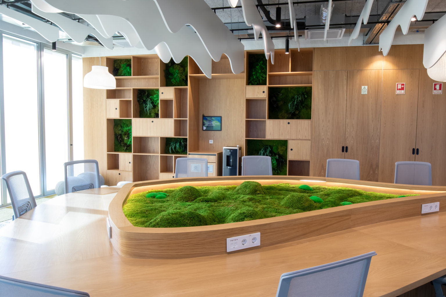 planters on meeting table in workspace
